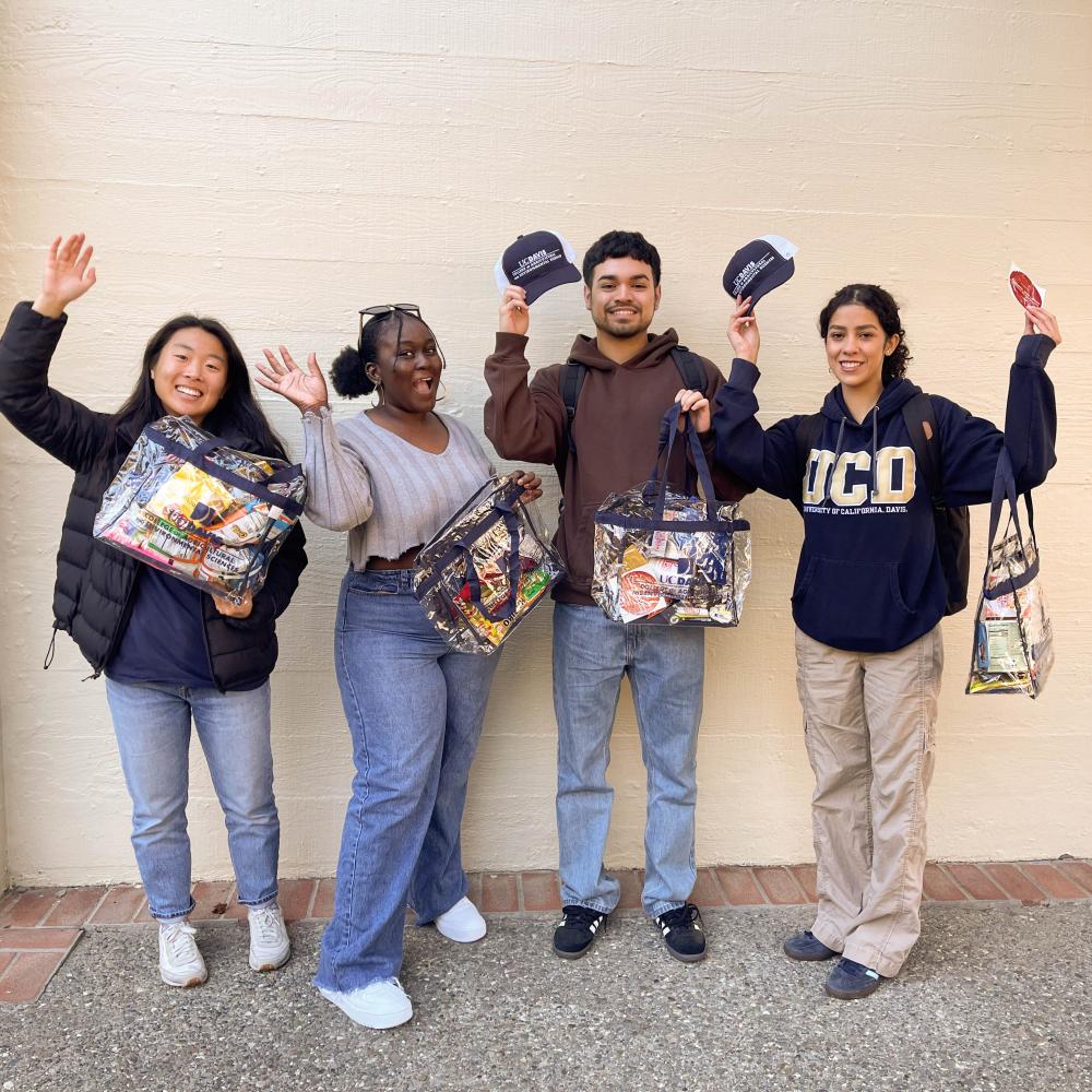 Four students standing outside Mrak Hall at the CA&ES Study Break event.