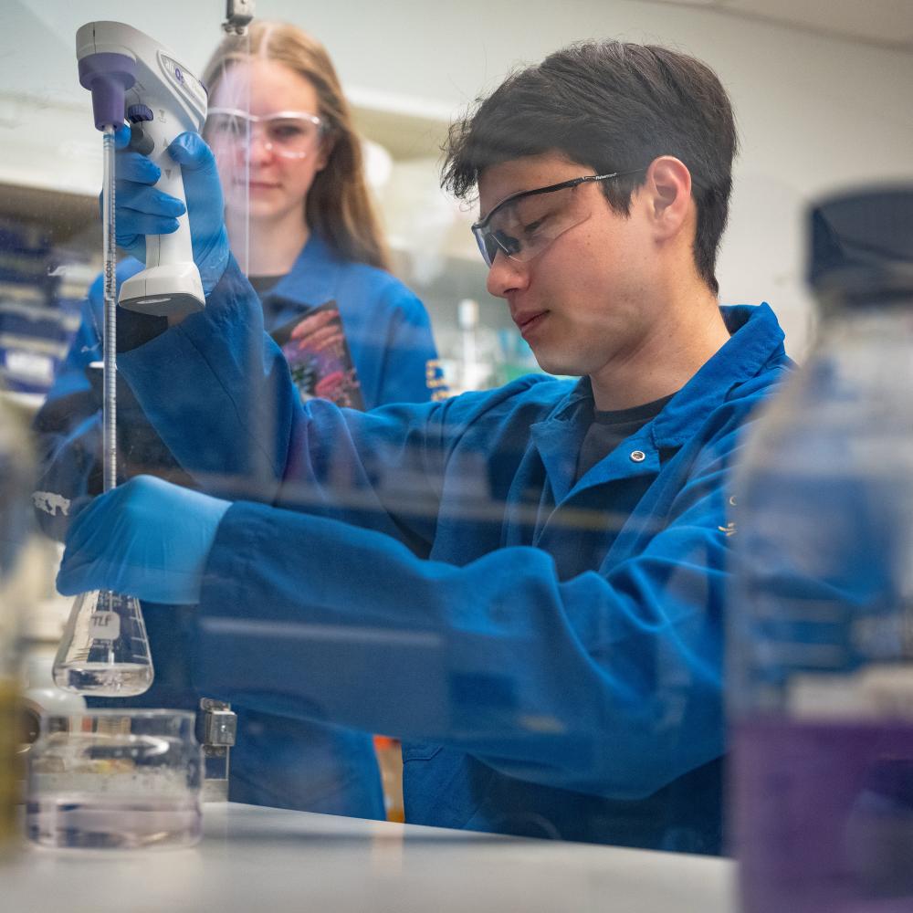 Two people working together in a lab.